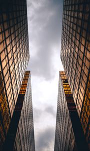 Preview wallpaper skyscrapers, buildings, sky, clouds, facade