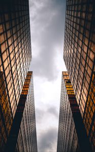 Preview wallpaper skyscrapers, buildings, sky, clouds, facade