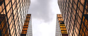 Preview wallpaper skyscrapers, buildings, sky, clouds, facade