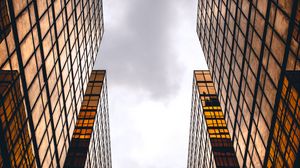 Preview wallpaper skyscrapers, buildings, sky, clouds, facade