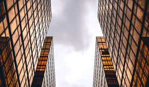 Preview wallpaper skyscrapers, buildings, sky, clouds, facade