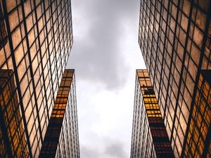 Preview wallpaper skyscrapers, buildings, sky, clouds, facade