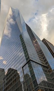 Preview wallpaper skyscrapers, buildings, sky, clouds, glass, reflection