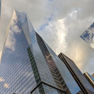 Preview wallpaper skyscrapers, buildings, sky, clouds, glass, reflection