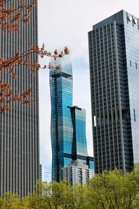 Preview wallpaper skyscrapers, buildings, trees, architecture, city