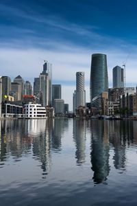 Preview wallpaper skyscrapers, buildings, water, reflection, city