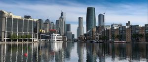 Preview wallpaper skyscrapers, buildings, water, reflection, city