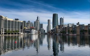 Preview wallpaper skyscrapers, buildings, water, reflection, city