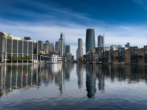 Preview wallpaper skyscrapers, buildings, water, reflection, city
