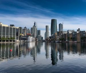 Preview wallpaper skyscrapers, buildings, water, reflection, city