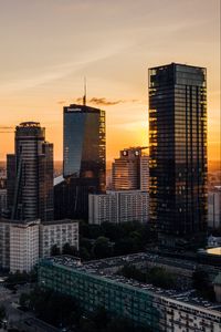 Preview wallpaper skyscrapers, city, aerial view, sunset, buildings