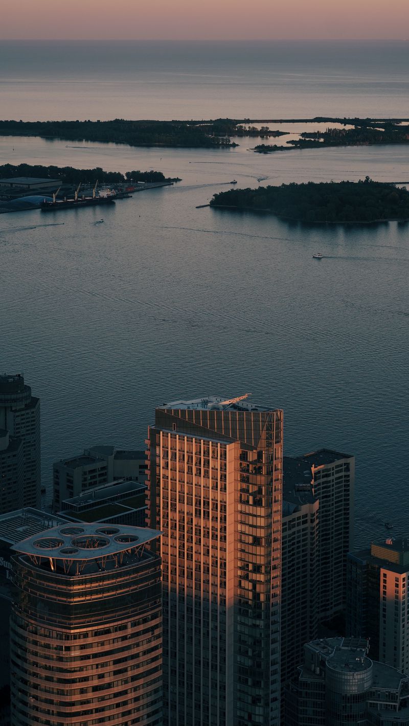 800x1420 Wallpaper skyscrapers, city, buildings, river