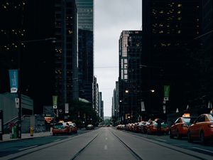 Preview wallpaper skyscrapers, city, road, cars