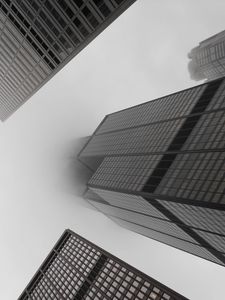 Preview wallpaper skyscrapers, fog, black and white