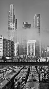 Preview wallpaper skyscrapers, fog, bridge, city, black and white