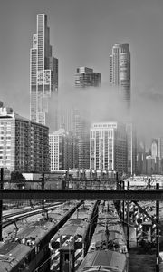 Preview wallpaper skyscrapers, fog, bridge, city, black and white
