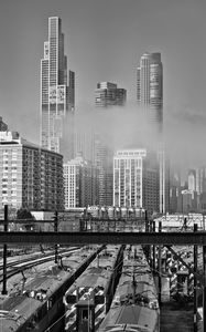 Preview wallpaper skyscrapers, fog, bridge, city, black and white