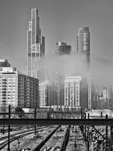 Preview wallpaper skyscrapers, fog, bridge, city, black and white