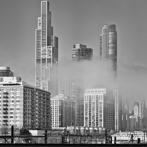 Preview wallpaper skyscrapers, fog, bridge, city, black and white