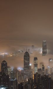 Preview wallpaper skyscrapers, fog, lights, night, city