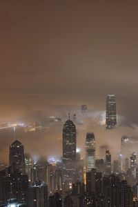 Preview wallpaper skyscrapers, fog, lights, night, city