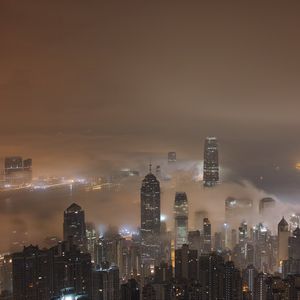 Preview wallpaper skyscrapers, fog, lights, night, city