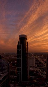 Preview wallpaper skyscrapers, houses, streets, traffic, metropolis, sky, clouds, dawn