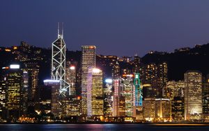 Preview wallpaper skyscrapers, lights, city, glow, night