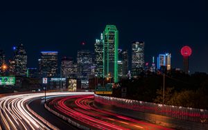Preview wallpaper skyscrapers, neon, road, long exposure, city, lights