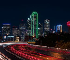 Preview wallpaper skyscrapers, neon, road, long exposure, city, lights