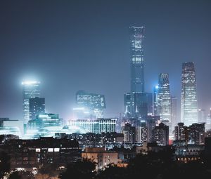 Preview wallpaper skyscrapers, night city, buildings, glow, night