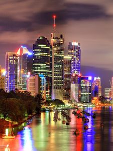 Preview wallpaper skyscrapers, night, light, boat