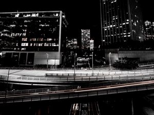 Preview wallpaper skyscrapers, road, road junction, night, lights, urban