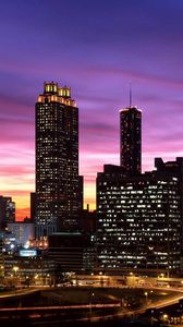 Preview wallpaper skyscrapers, sky, night, lights, buildings, panorama