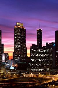 Preview wallpaper skyscrapers, sky, night, lights, buildings, panorama