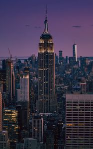 Preview wallpaper skyscrapers, towers, spire, city, lights, night