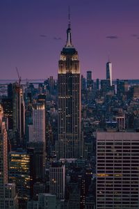 Preview wallpaper skyscrapers, towers, spire, city, lights, night