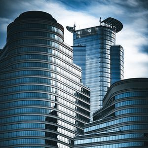 Preview wallpaper skyscrapers, windows, mirror, clouds, sky, city