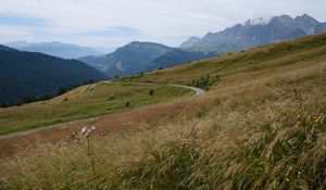 Preview wallpaper slope, field, path, mountains, fog, sky