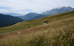 Preview wallpaper slope, field, path, mountains, fog, sky