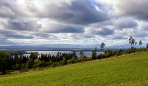 Preview wallpaper slope, field, trees, distance, clouds