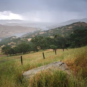 Preview wallpaper slope, grass, field, river, mountains, landscape