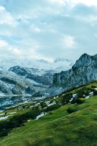 Preview wallpaper slope, grass, snow, peaks