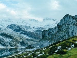 Preview wallpaper slope, grass, snow, peaks