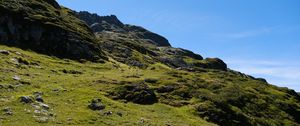 Preview wallpaper slope, hill, stones, landscape, nature, grass