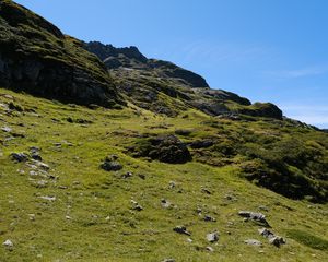 Preview wallpaper slope, hill, stones, landscape, nature, grass