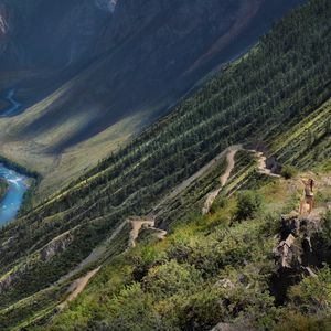 Preview wallpaper slope, mountain, path, twisting, river, girl, posing