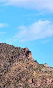 Preview wallpaper slope, mountain, rocks, bushes, sky
