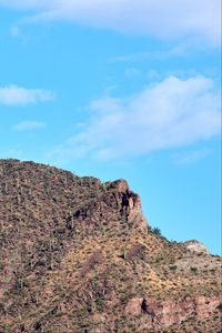 Preview wallpaper slope, mountain, rocks, bushes, sky