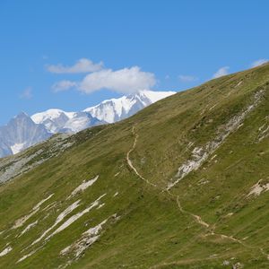 Preview wallpaper slope, mountains, grass, snow, nature